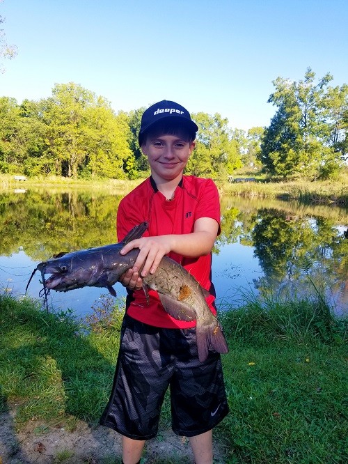 Kid holding fish