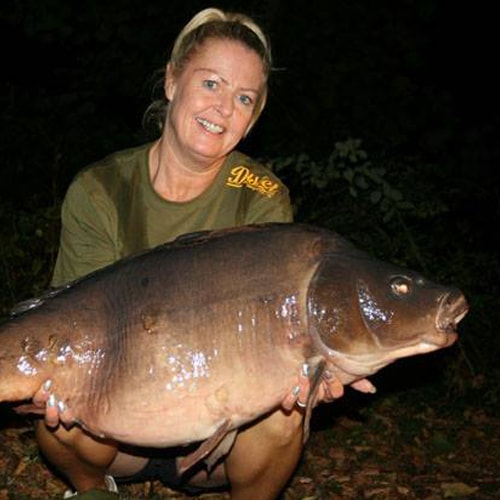 woman holding carp